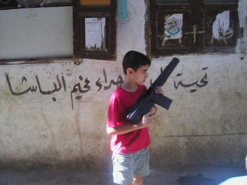 kid with toy gun, chatila